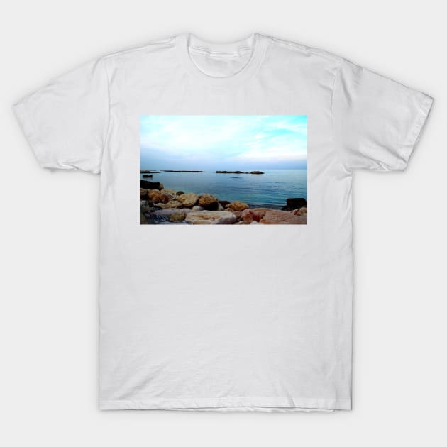 Calm Adriatic sea surrounded by massive rocks under the light blue sky T-Shirt by KristinaDrozd